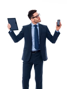 Handsome businessman holding in his hands digital tablet and mobile phone