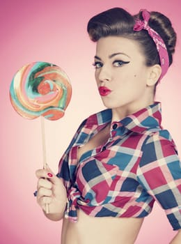 Retro sexy woman with large lollipop