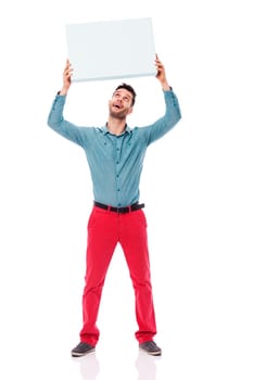 Happy man holding a blank sign overhead