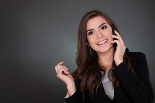 Beautiful young woman talking on mobile phone