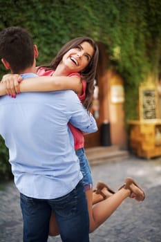 Young couple hugging on the city road