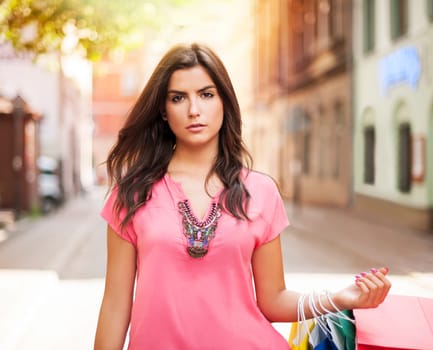 Gorgeous woman with shopping bag on the street