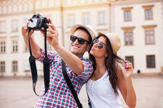 Happy tourists taking photo of themselves