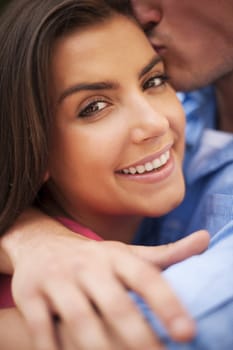 Affectionate man kissing beautiful woman