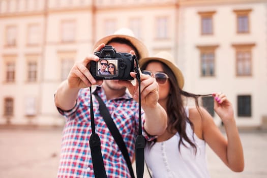 Lovely couple taking photo of themselves