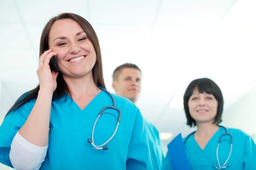 Female surgeon talking on mobile phone