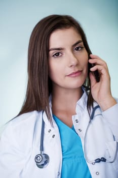 Young female doctor on the phone