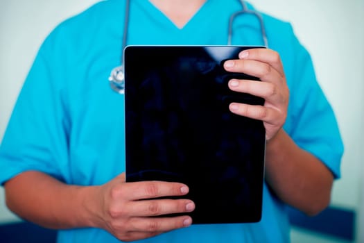 Doctor holding digital tablet