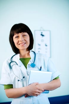 Smiling doctor holding tablet