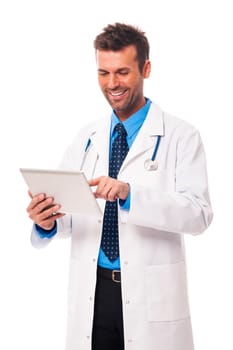 Male doctor working on digital tablet