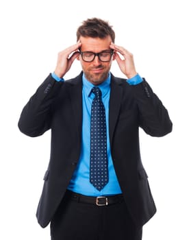 Businessman wearing glasses with awful headache