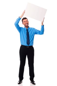 Smiling businessman holding blank placard