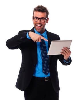 Shocked businessman showing on digital tablet
