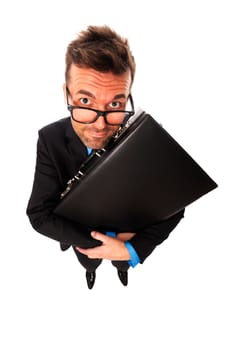 Cunning businessman squeezing briefcase