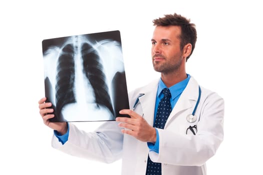 Male doctor examining x-ray image