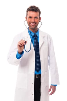 Candid male doctor holding stethoscope