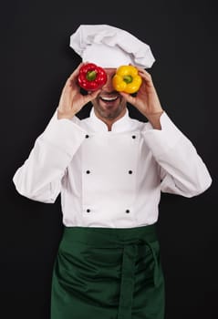 Funny chef covering his eyes of paprika