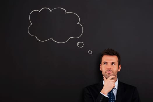 Portrait of pensive and thoughtful businessman