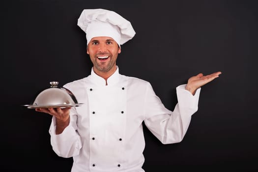 Smiling chef recommended main course