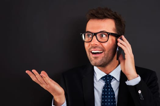 Businessmen discussing on mobile phone