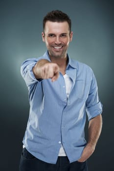 Mature man pointing at you