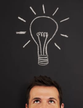 Man with light bulb above his head