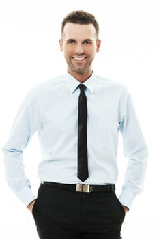 Happy businessman with his hands in pockets