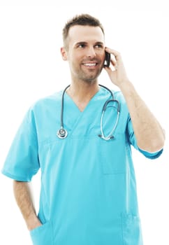 Handsome male surgeon talking on a mobile phone