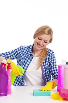 Cheerful woman cleaning the table