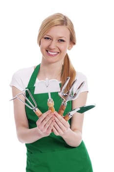 Happy young woman with gardening equipment