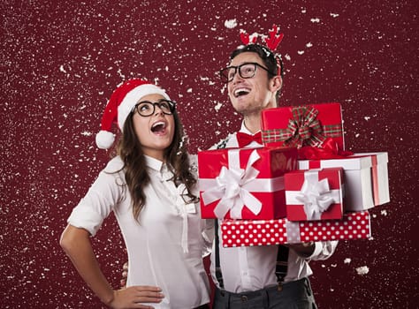 Happy nerd couple with christmas presents