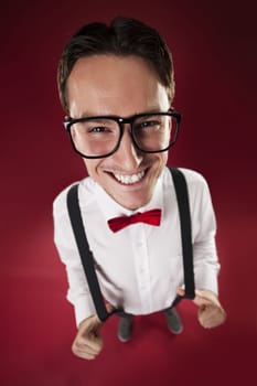 Portrait of nerdy man wearing red bow tie and suspenders