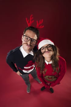 Nerd couple have fun with fake mustache