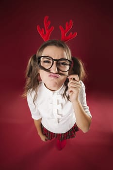 Portrait of funny young woman with mustache