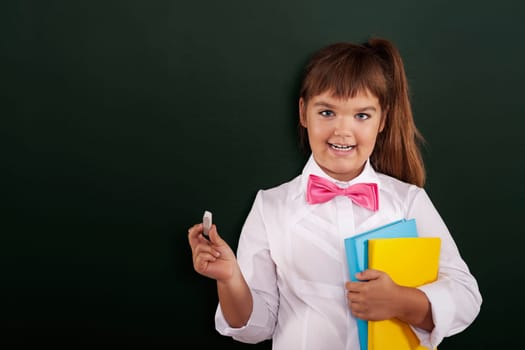 Happy little girl is ready to start lesson
