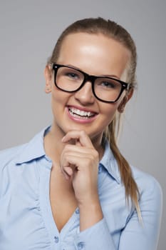 Fashionable and beautiful businesswoman in glasses