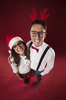Portrait of smiling nerd couple in christmas time