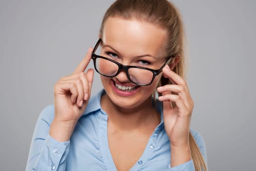 Cute young businesswoman wearing fashion glasses