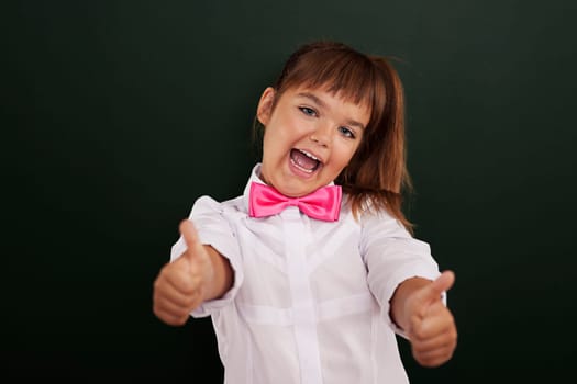 Happy girl showing thumb up