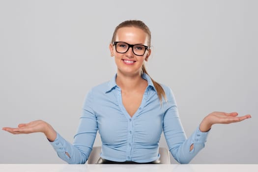 Confident businesswoman welcome gesture