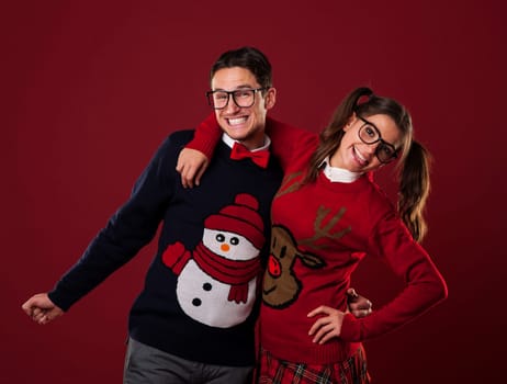 Portrait of nerd couple wearing funny sweaters