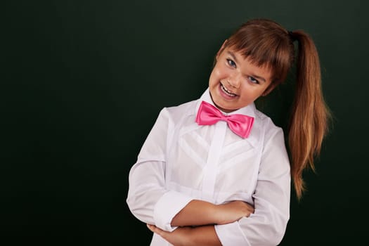 Portrait of cute little schoolgirl