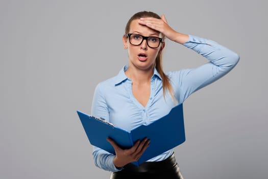 Shocked businesswoman make a mistake in office documents