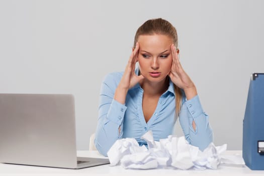 Portrait of depressed businesswoman in work