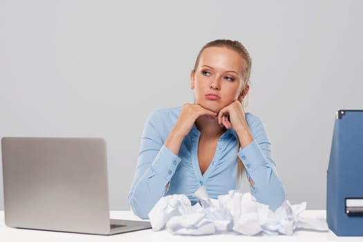 Portrait of boring blonde businesswoman