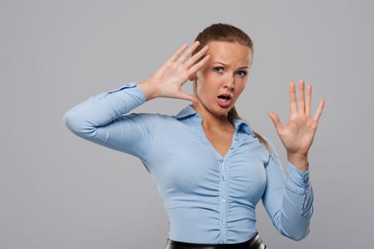 Portrait of terrified young businesswoman