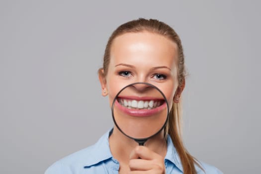 Blonde woman with big white smile