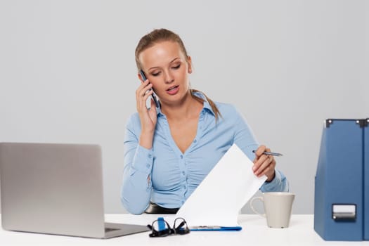 Portrait of busy young businesswoman