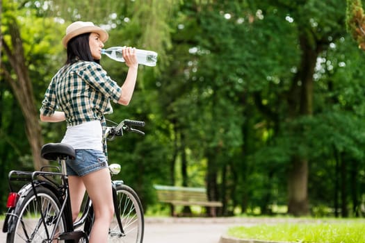 Cyclist drinking mineral water