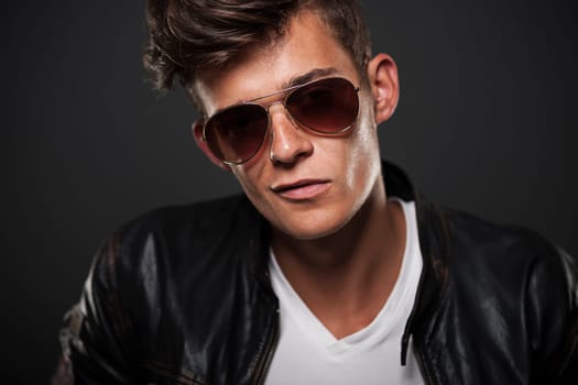 Portrait of bad boy wearing glasses